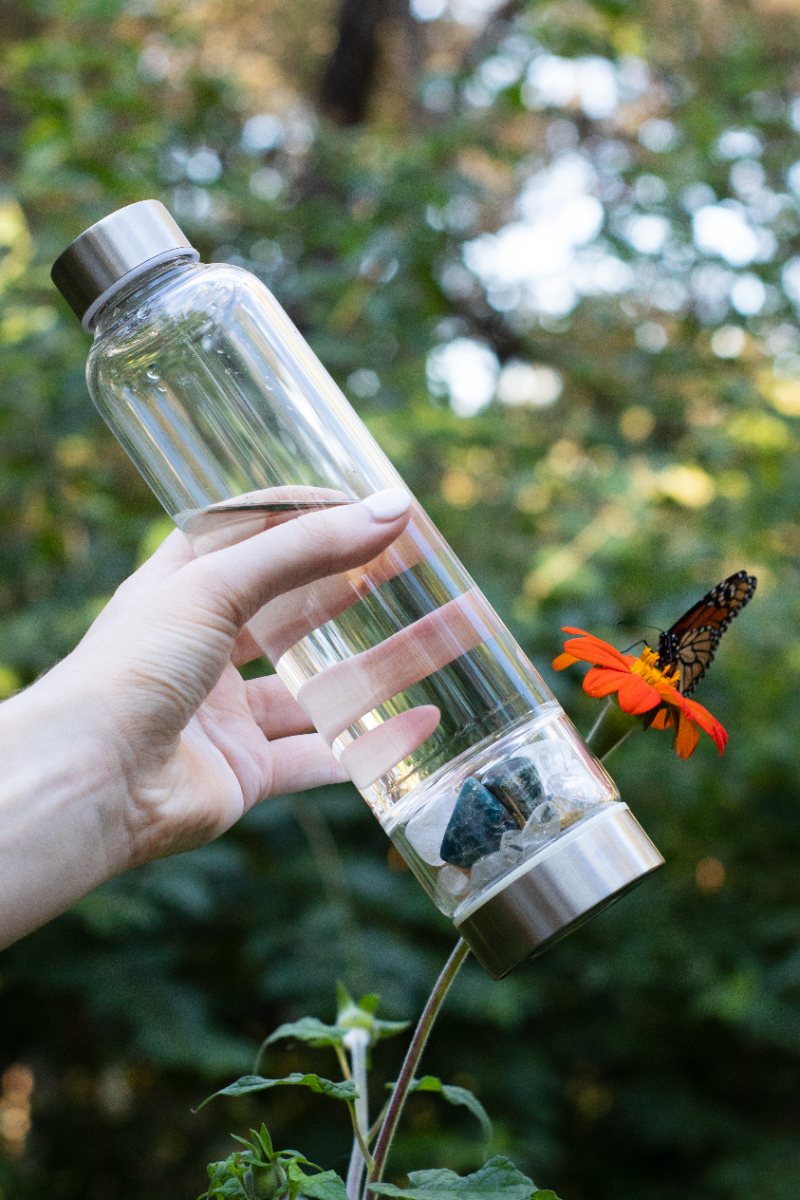 Holding the Elixir2Go with a monarch butterfly