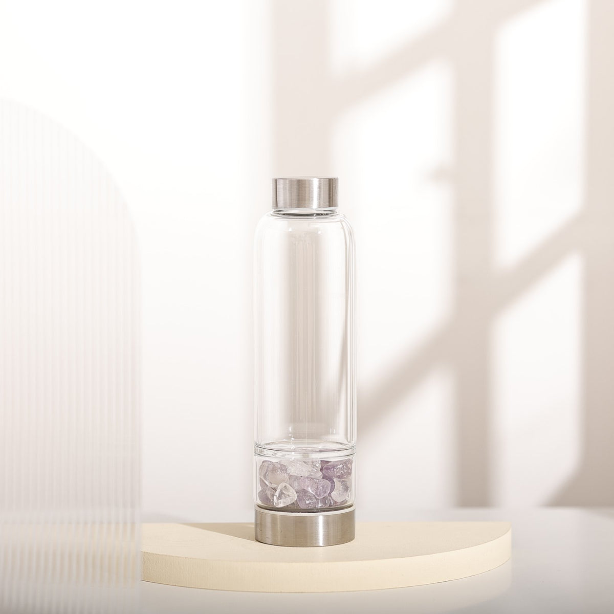 The Elixir2Go glass bottle on a pedestal
