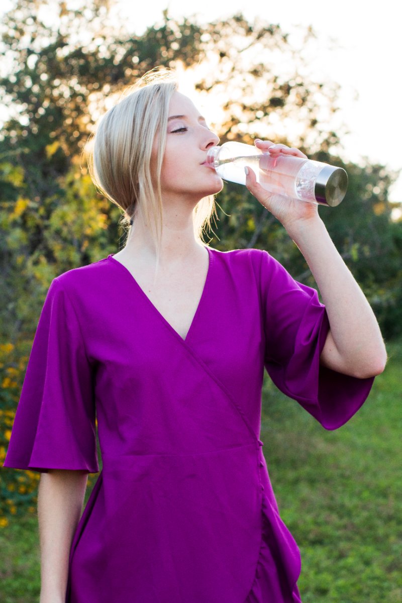 Drinking from an Elixir2Go crystal water bottle