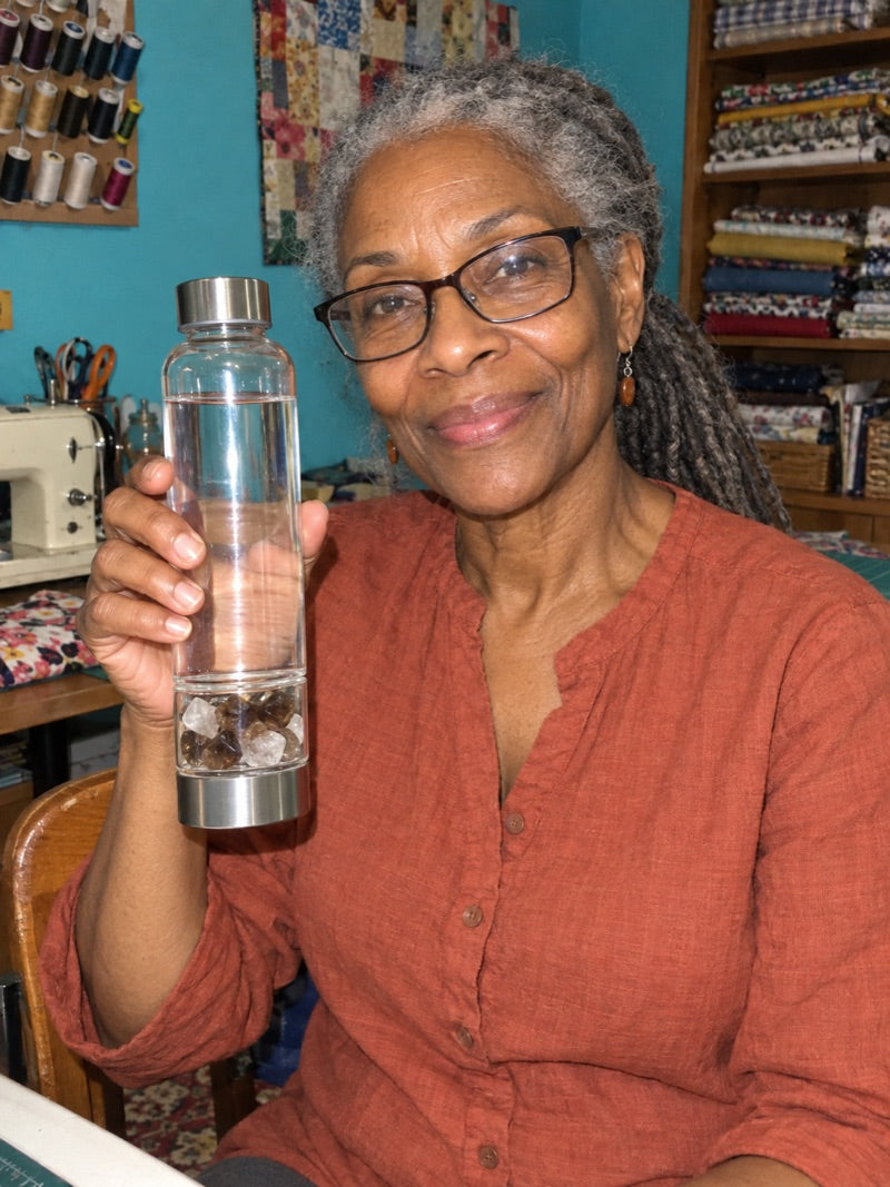 Customer holding the Elixir2Go crystal water bottle