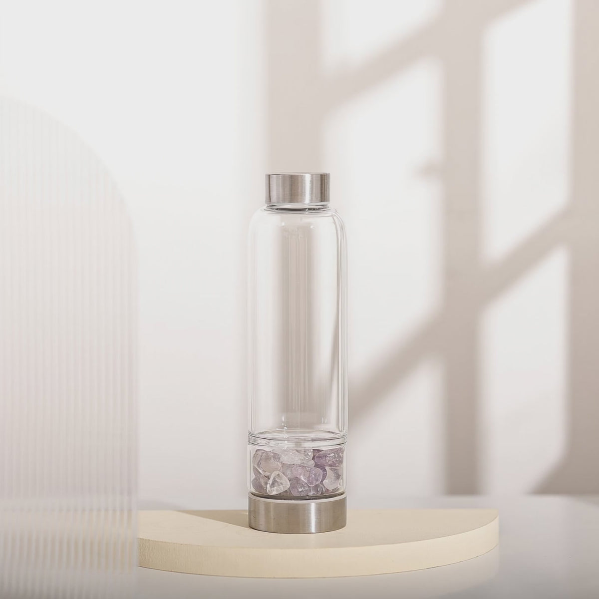 The Elixir2Go crystal water bottle turning on a pedestal